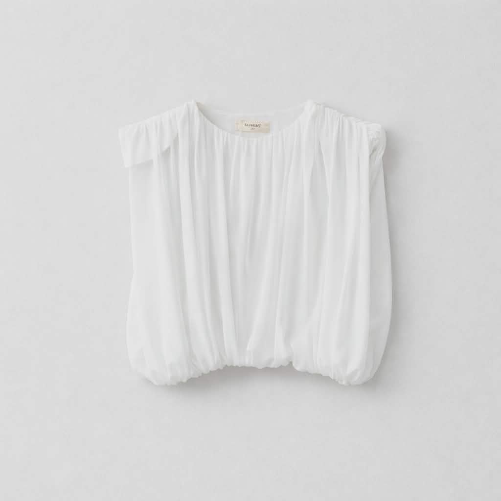 Witte top met epaulletten en bloezend effect