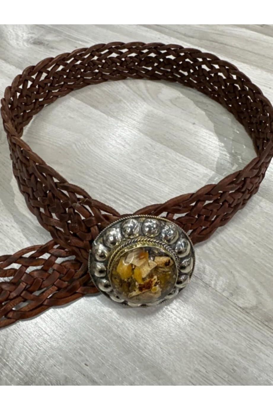 Bruin gevlochten riem met statement gesp