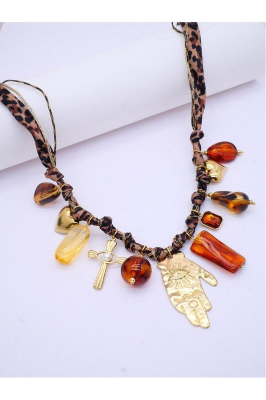 Stoffen ketting met kwastjes van roestvrij staal en hars.